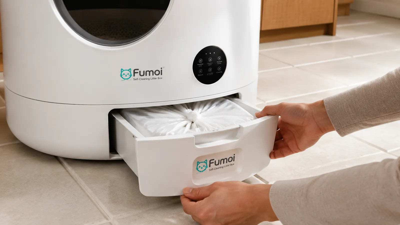 The sealed waste drawer of the Fumoi litter box being removed for weekly emptying